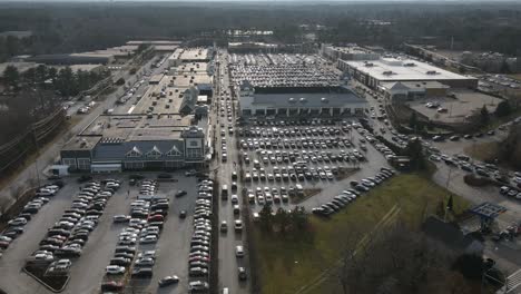 Aerial-time-lapse-showing-heavy-traffic-outside-shopping-plaza-in-South-Hingham,-Massachusetts-during-festive-season