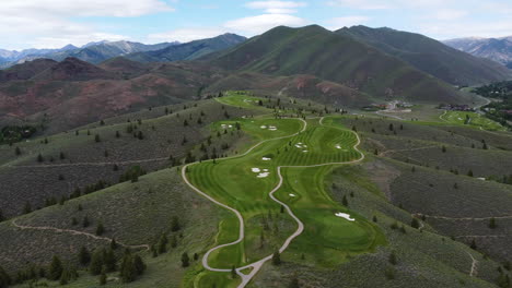 jib-drone-view-of-the-slope-mountain-with-the-green-golf-course