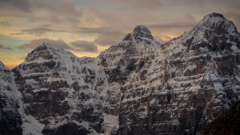 Sunrise-Time-Lapse,-Valley-of-Ten-Peaks,-Banff-National-Park,-Canada,-Clouds-Moving-Above-Snow-Capped-Summits-on-Cold-Day