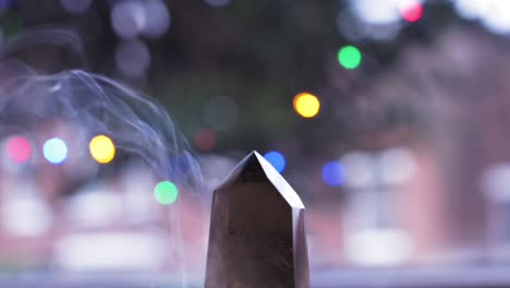 Magic-prism-with-incense-smoke-on-blurry-background,-spiritual-purification-therapy,-wizardly-object