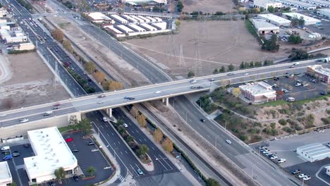 Aerial-view-of-a-highway-and-overpass-with-traffic-in-Santa-Clarita,-America