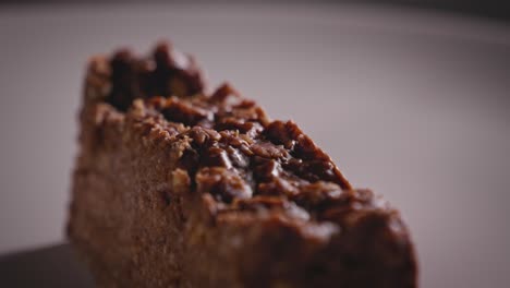 Close-up-View,-Spinning-Plate-With-Chocolate-Oat-Cake,-Yummy-Piece-of-Cake---Steady-Shot