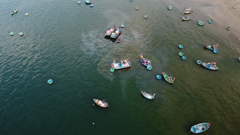 Fuel-leak-from-a-local-fishing-vessel-anchored-on-coastline,-Vietnam