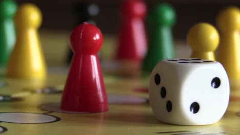 Traditional-board-game-with-a-dice,-amusement-or-gambling-concept-with-no-people,-close-up