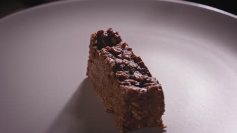Spinning-Plate-With-a-Delicious-Piece-of-Chocolate-Oat-Cake---Steady-Shot