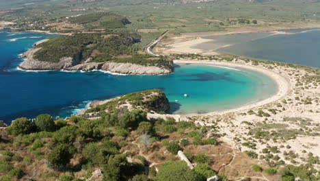 Horseshoe-shaped-Voidokilia-Beach-From-Nestor's-Cave-In-Messinia,-Peloponnese,-Greece