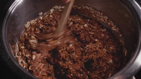 Hand-Stirring-The-Batter-For-a-Delicious-Cake,-Baking-Chocolate-Oat-Cake---Steady-Shot