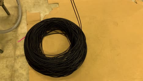 Reels-of-thermoplastic-rubber-o-ring-cord-falling-on-the-floor-after-production