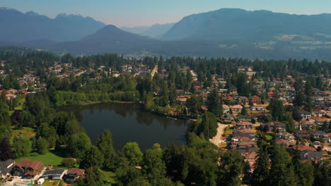 Scenic-aerial-view-over-Como-Lake-Park-in-Coquitlam,-Greater-Vancouver,-British-Columbia