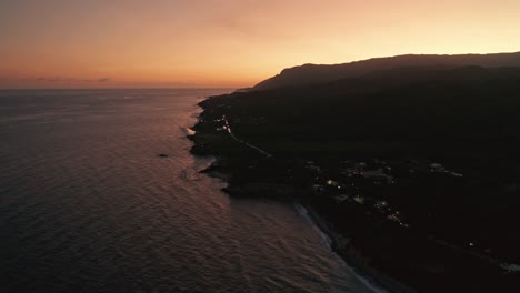 Golden-light-glow-of-sunset-along-Caribbean-coastline,-high-angle-view