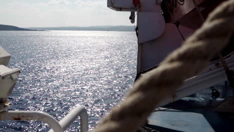 View-of-Mediterranean-sea-from-ferry,-rope-in-foreground