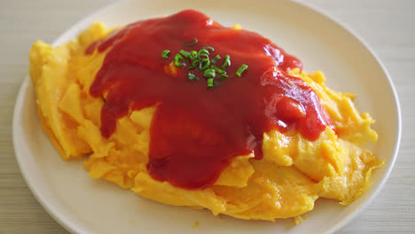 Flavored-Fried-Rice-in-an-Omelet-Wrapping-or-Omurice-in-Japanese-style---Asian-food-style