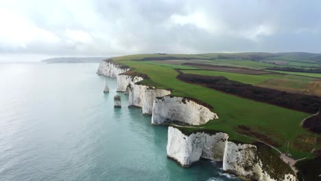Drone-shot-flying-over-the-Jurassic-Coast-in-Dorset-with-chalk-cliffs