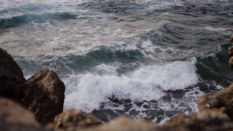 Slowmo-gimbal-shot-of-ocean-waves,-Malta