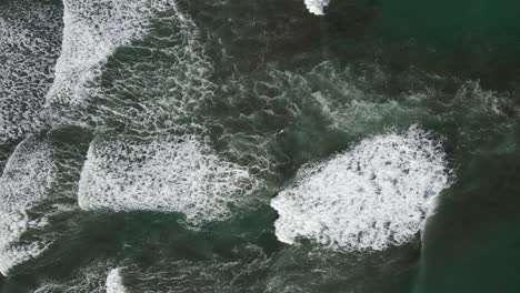 Birds-eye-view-of-ocean-waves-crashing