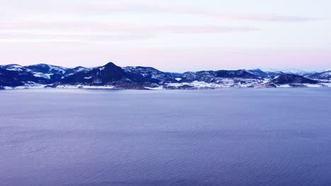 Aerial-View-Of-Calm-Sea-With-Scenic-Mountain-Range-In-Norway