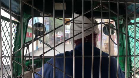 rickshaw-driver-guiding-it-through-narrow-streets-on-the-city