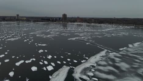 Aerial-view-of-lake-Bde-Maka-Ska-in-Minneapolis-during-winter-with-the-surface-completely-frozen