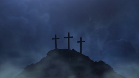 three-crosses-on-a-mountain-silhouette-against-a-thunderstorm-dark-cloud-background