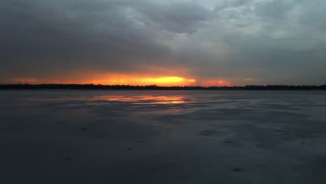 Amazing-color-on-the-clouds-during-sunset-over-a-frozen-lake-in-Minnesota