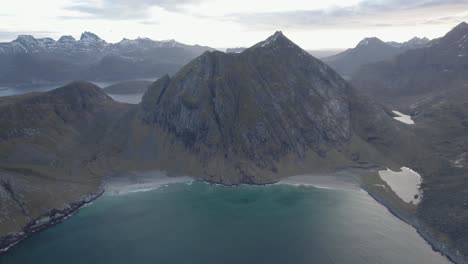 Aerial-view-overlooking-the-Kvalvika-and-Vestervika-beaches,-fall-in-Lofoten,-Norway---circling,-drone-shot