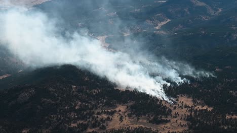 Forest-fires-burning-south-of-Denver-in-the-Colorado-Rocky-Mountains,-aerial