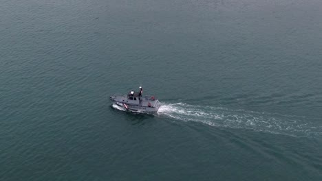 Coastguard-Boat-Leaving-Wake-In-The-Water-Near-Callao-District-In-Lima,-Peru