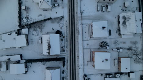 Aerial-top-down-view-of-lubawa-city-of-Poland-after-snow-storm,-winter-white-landscape-urban-cityscape