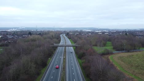 A557-Rainhill-Runcorn-Widnes-expressway-aerial-view-down-British-highway-push-left-forwards