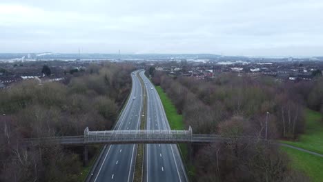 A557-Rainhill-Runcorn-Widnes-expressway-aerial-view-down-British-highway-slow-forwards-shot