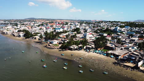 An-aerial-view-of-overwhelmed-with-round-fishing-boats-coastline-of-Mui-Ne-Bay