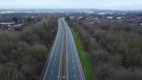 A557-Rainhill-Runcorn-Widnes-expressway-aerial-view-down-British-highway-rising-pull-back