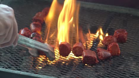 Chorizo-and-sausages-being-cooked-on-a-grill