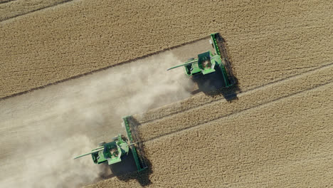 Tractor-Machine-Harvesting-At-The-Vast-Farmland-In-Saskatchewan,-Canada