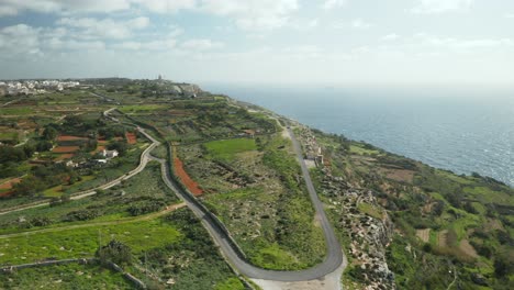 AERIAL:-Dingli-Cliffs-with-Lone-Hill-Road-near-Mediterranean-Sea-on-a-Sunny-Day-in-Winter