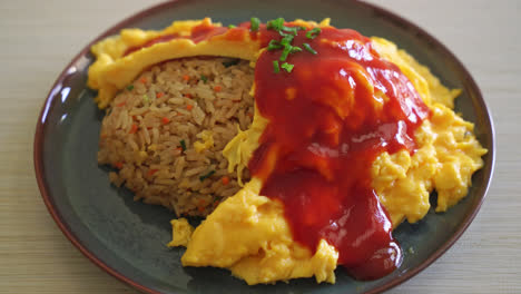 Flavored-Fried-Rice-in-an-Omelet-Wrapping-or-Omurice-in-Japanese-style---Asian-food-style