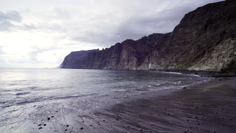 Pan-right-gimbal-shot-of-giants-cliffs-in-Tenerife-on-cloudy-day