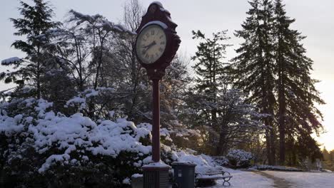 Gimbal-tilt-up-shot-of-clock-in-street-of-Vancouver,-winter-landscape