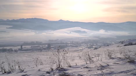 Slow-motion-pan-across-stunning-snow-panorama-landscape-with-Tatra-mountains-in-backdrop