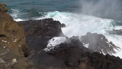 Rock-constriction-and-ocean-waves-create-impressive-blow-hole-feature