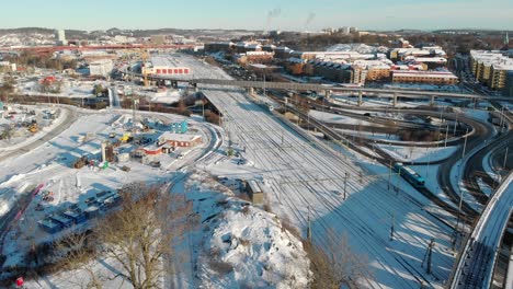 Intersections-In-Winter-Landscape,-Snow-Covered-Roads,-Gothenburg,-Sweden,-Aerial