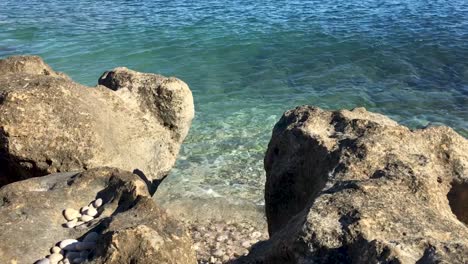 Waves-Gently-Crashing-on-a-Rocky-Mediterranean-Shore