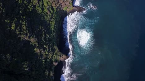 Waves-Rushing-On-Cliffs-At-Nogales-Black-Volcanic-Sand-Beach,-Aerial