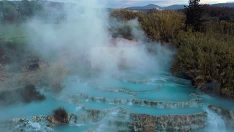 The-geothermal-thermal-hot-springs-bath-and-waterfall-at-Saturnia,-Tuscany-Italy-close-to-Siena-and-Grosseto