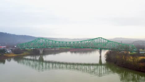 Steel-truss-bridge-in-Point-Pleasant,-West-Virginia-with-drone-video-moving-up