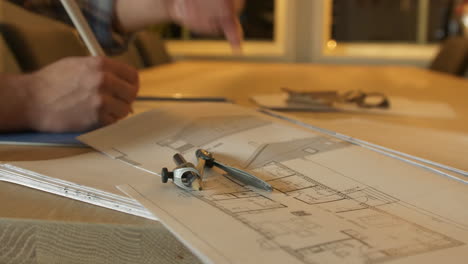 Architect-working-at-drawing-table