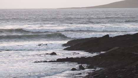 Winter-ocean-with-rolling-waves-and-rocky-coast-in-Ireland