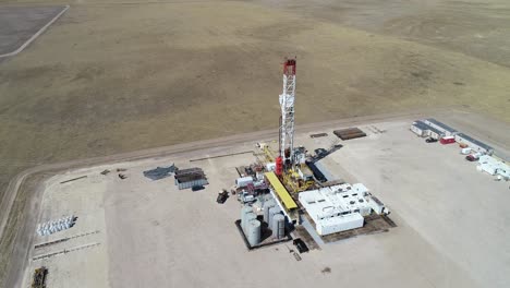 A-three-hundred-foot-half-orbit-of-a-large-drilling-operation-revealing-another-rig-in-the-same-field