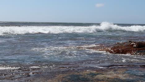 Waves-crashing-onto-rocky-shoreline