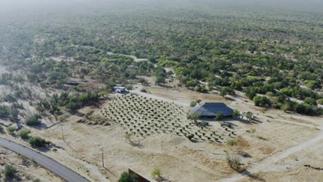 Aerial-shot-of-an-agriculture-farm-in-a-desert-in-Baja-California,-Mexico